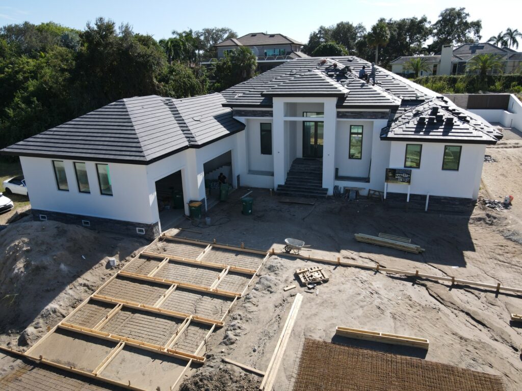 Drone construction progress photo of a front elevation in Naples, FL — TrueVision Photography