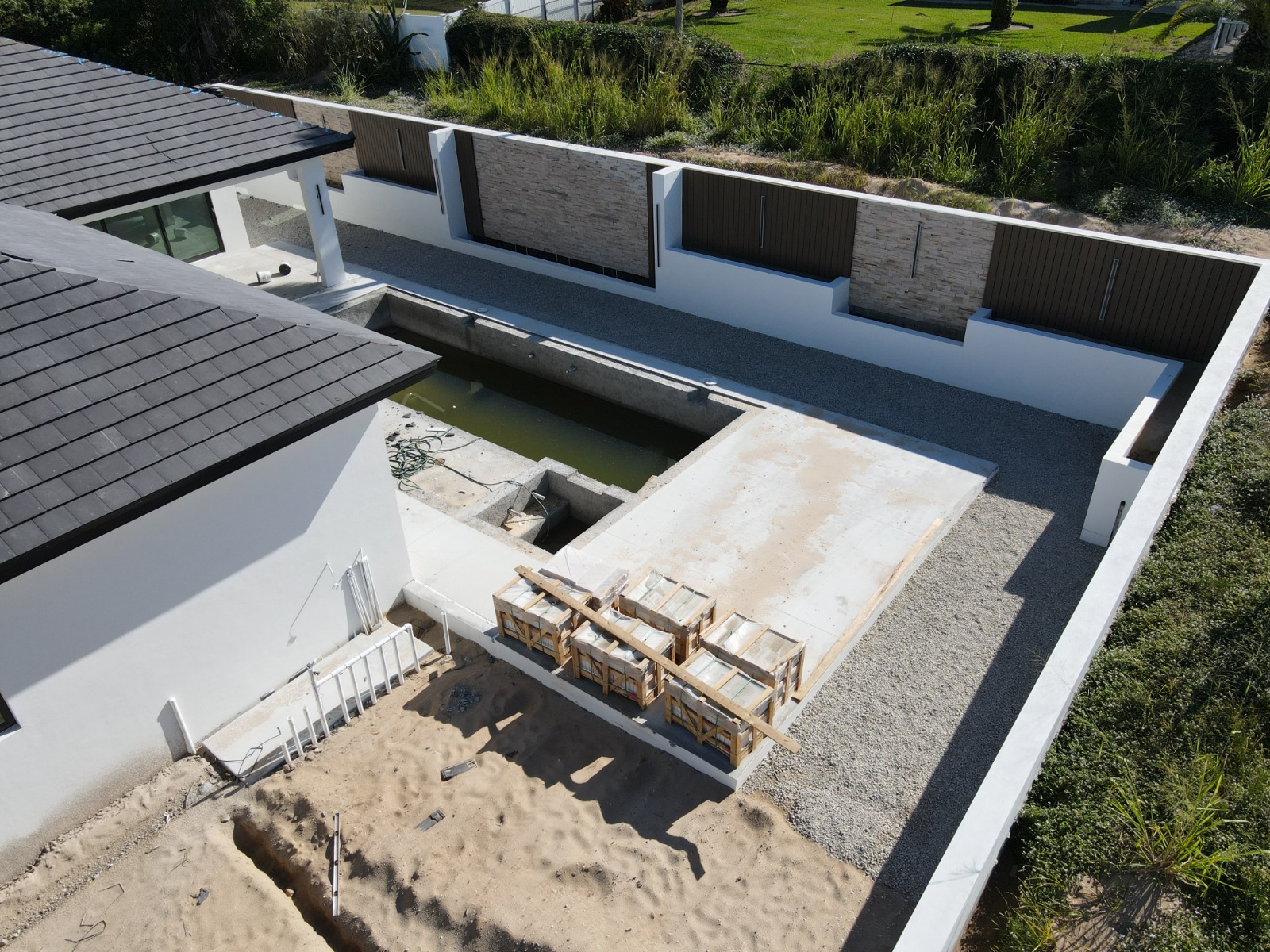 How Often Should You Document Construction Progress with Drone Photography? 3 Aerial construction progress photo of a pool and courtyard in Naples, FL — TrueVision Photography